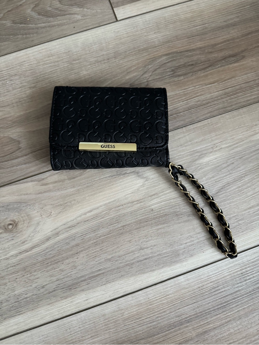 GUESS Black Embossed Logo Wristlet with Gold Accent Chain